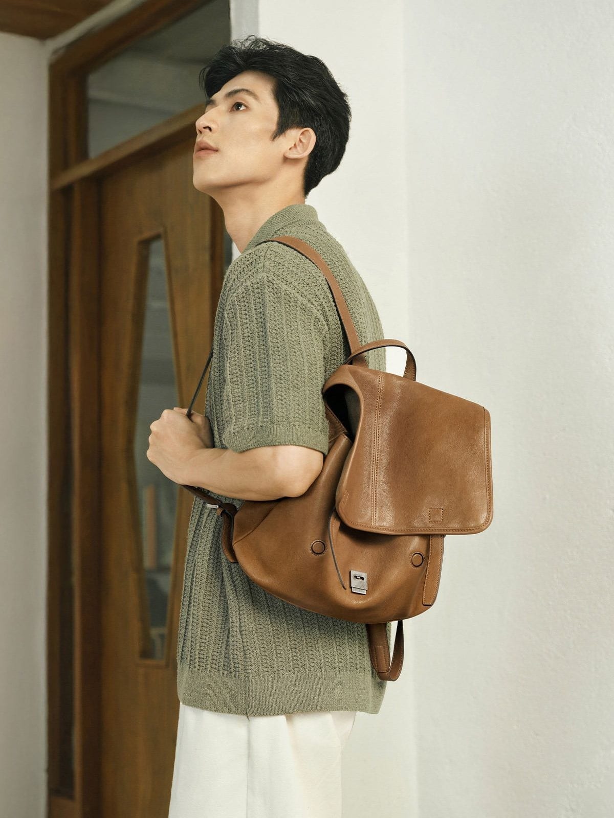 QIUZHEN Vegetable Tanned Goatskin Messenger Backpack in Brown - On Male Model