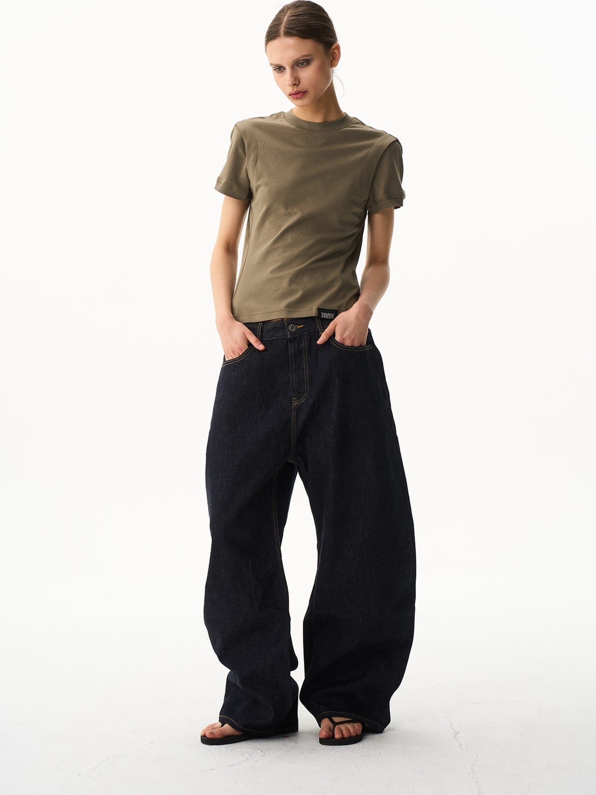 BLINDNOPLAN Curved Wide Leg Raw Denim Jeans in Denim - On Female Model