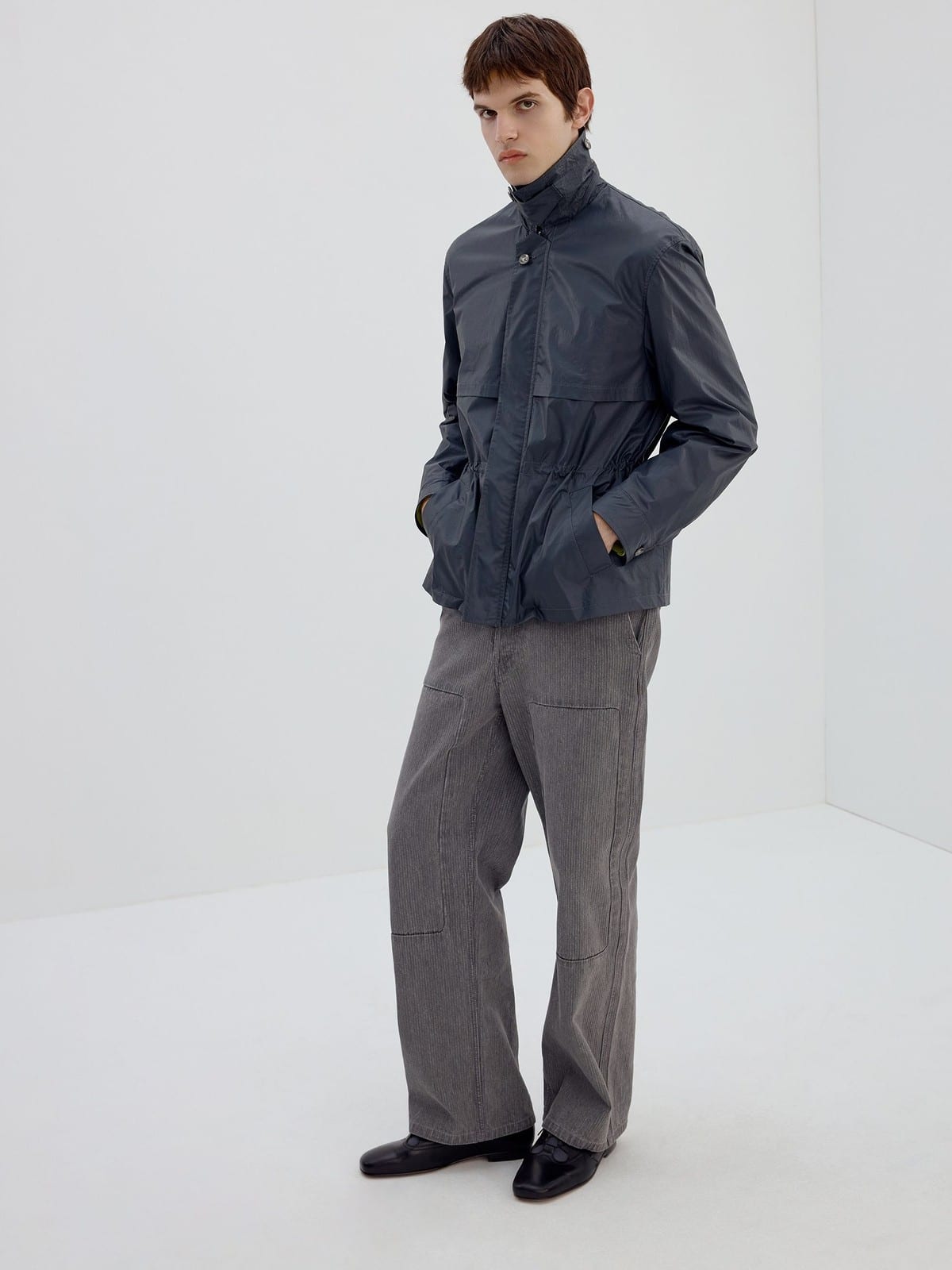 SIMPLE PROJECT Coated Drawstring Hunting Jacket in Gray - On Male Model