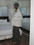 RARELY ALIKE Fleece Lined Hooded Windbreaker in Gray - On Female Model