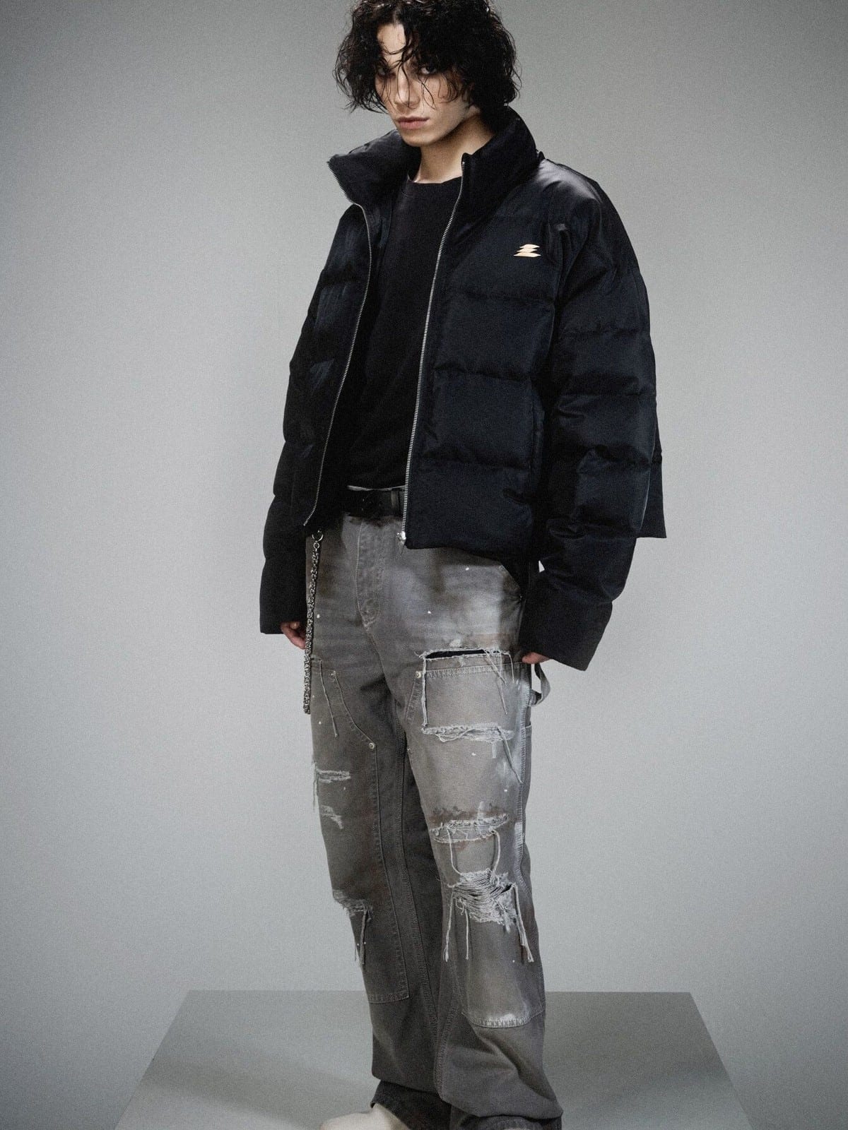 LOSTCTRL Minimalist Nylon Puffer Jacket in Black - On Male Model