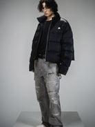 LOSTCTRL Minimalist Nylon Puffer Jacket in Black - On Male Model