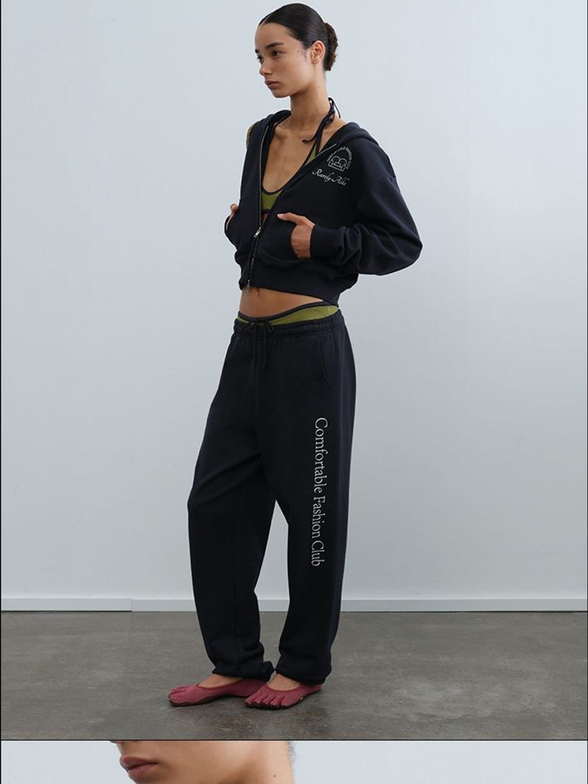 RARELY ALIKE Graphic Cropped Zip Up Hoodie in Navy Blue - On Female Model