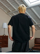 MEDM Glitch Logo Graphic Cotton T Shirt in Black - On Model