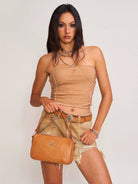SMFK Cross Emblem Burnished Leather Shoulder Bag in Brown - On Female Model
