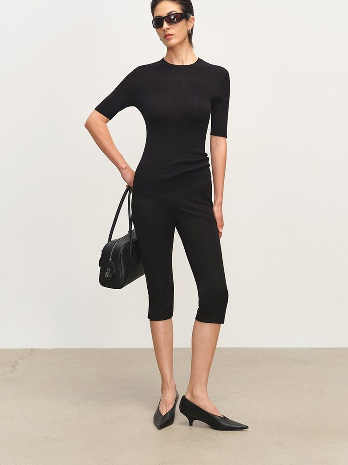 MSBEAST Viscose Blend Capri Leggings in Black - On Female Model