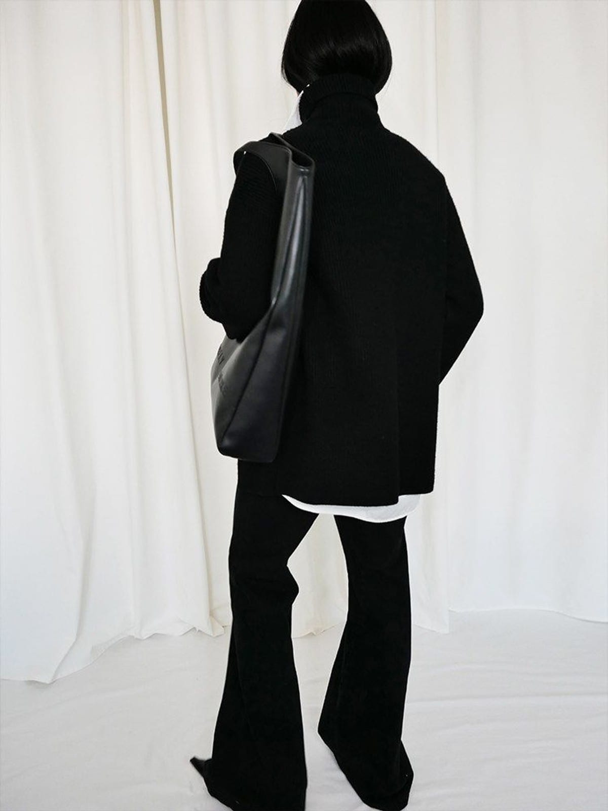 RARELY ALIKE Curved Seam Denim Flare Jeans in Black - On Model