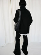 RARELY ALIKE Curved Seam Denim Flare Jeans in Black - On Model