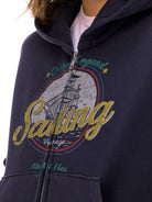 alright then Washed Cotton Graphic Zip Up Hoodie in Blue - On Model