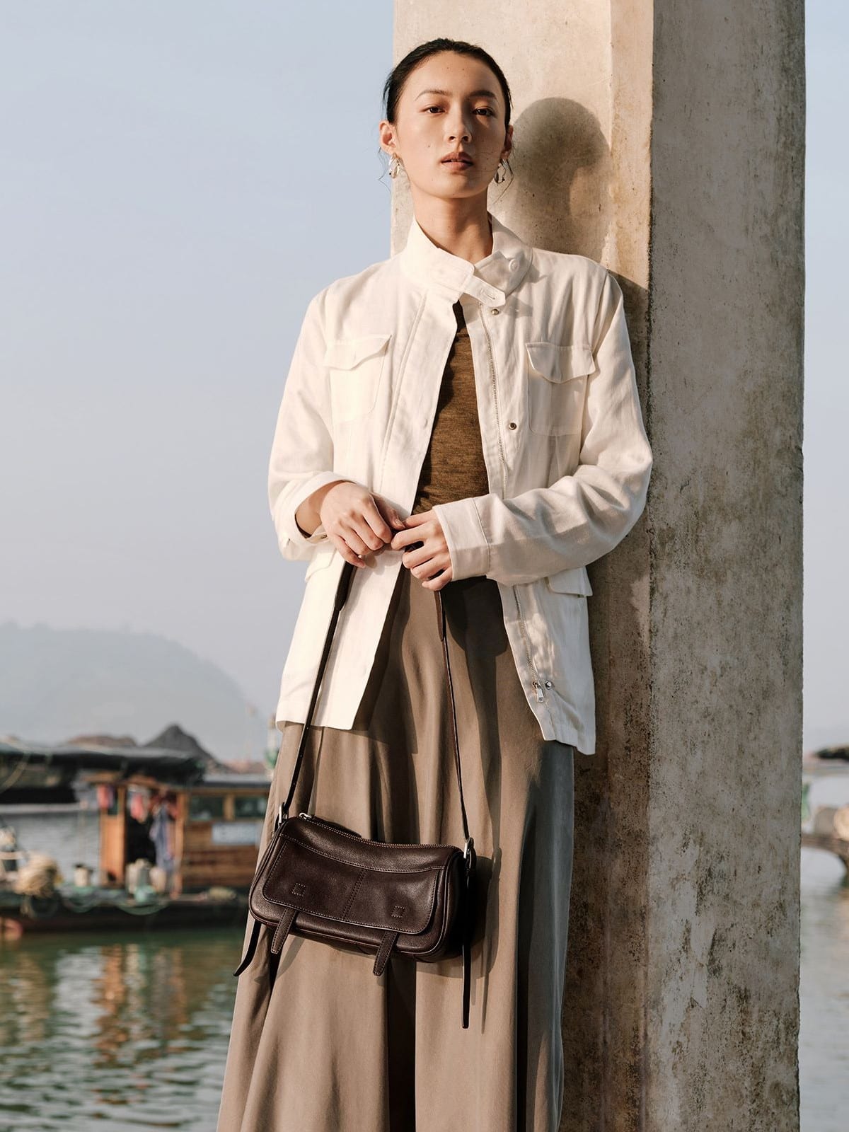 QIUZHEN Vegetable Tanned Leather Camera Bag in Brown - On Female Model