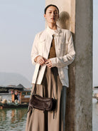 QIUZHEN Vegetable Tanned Leather Camera Bag in Brown - On Female Model