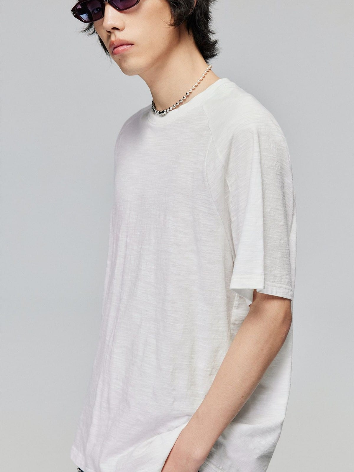 SIMPLE PROJECT Washed Slub Cotton Raglan Tee in White - On Male Model