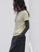 Random Piece Merino Wool U Neck Short Sleeve T Shirt in Beige - On Female Model