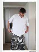 UNKNOWNWORLD Small Logo Cotton T Shirt in White - On Male Model
