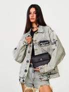 SMFK Small Leather Badge Chain Crossbody in Black - On Female Model