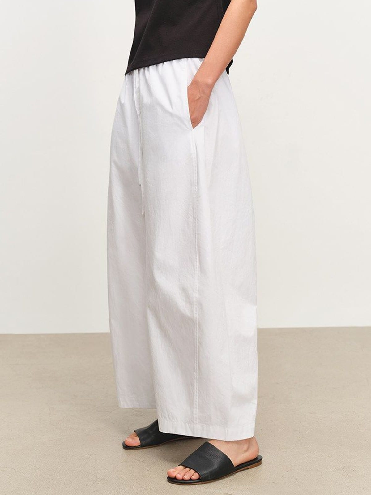 MSBEAST Paper Texture Cotton Balloon Pants in White - On Female Model