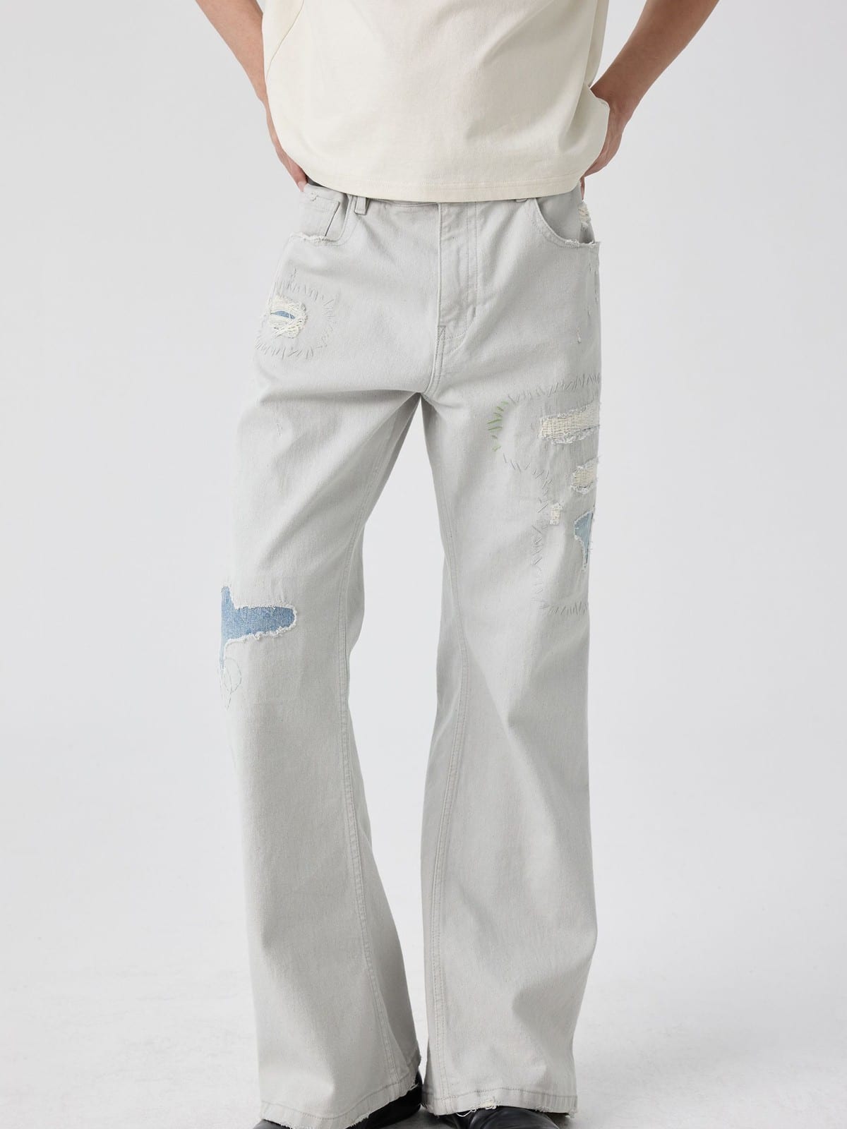 SIMPLE PROJECT Patchwork Distressed Flared Jeans in White - On Male Model