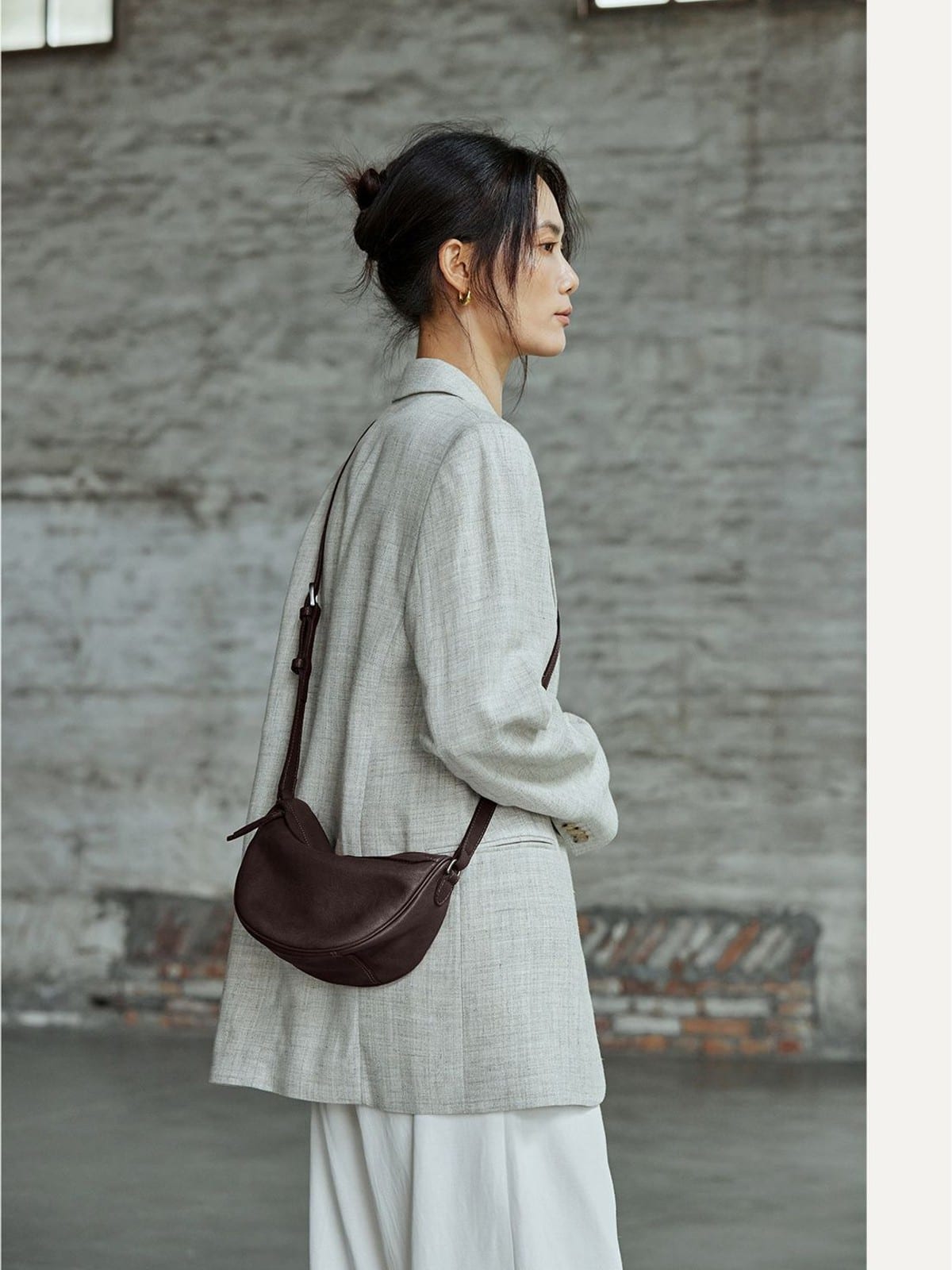 QIUZHEN Vegetable Tanned Leather Crescent Bag in Brown - On Female Model