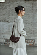 QIUZHEN Vegetable Tanned Leather Crescent Bag in Brown - On Female Model