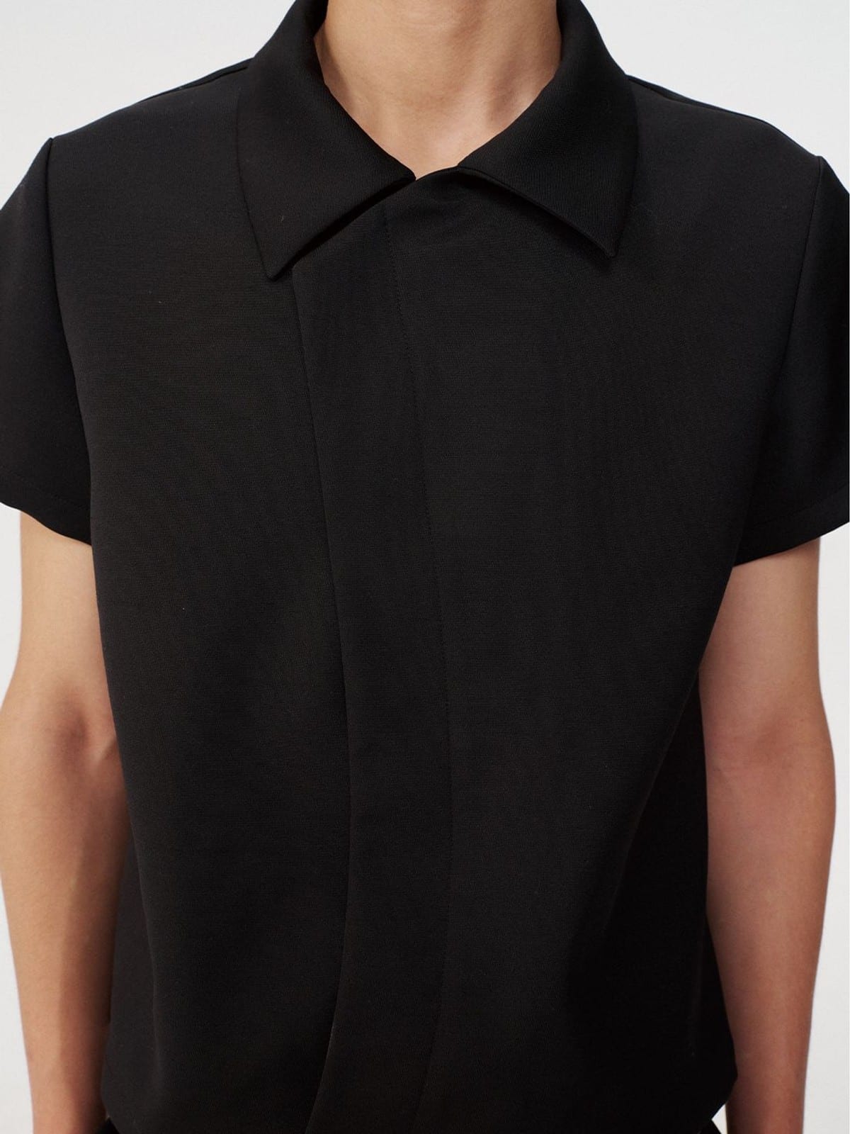 JCAESAR STUDIO Asymmetric Concealed Button Short Sleeve Shirt in Black - On Male Model