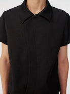 JCAESAR STUDIO Asymmetric Concealed Button Short Sleeve Shirt in Black - On Male Model