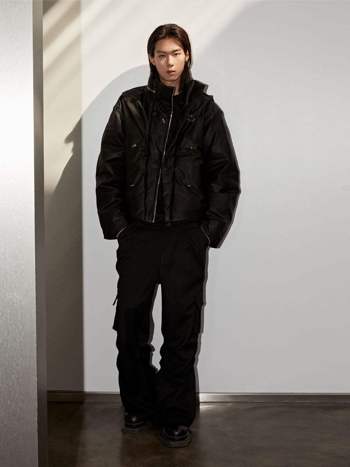 Y OFFICIAL Cropped Faux Leather Down Puffer in Black - On Male Model