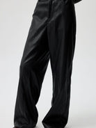SIMPLE PROJECT Twisted Seam Metallic Faux Leather Trousers in Black - On Model