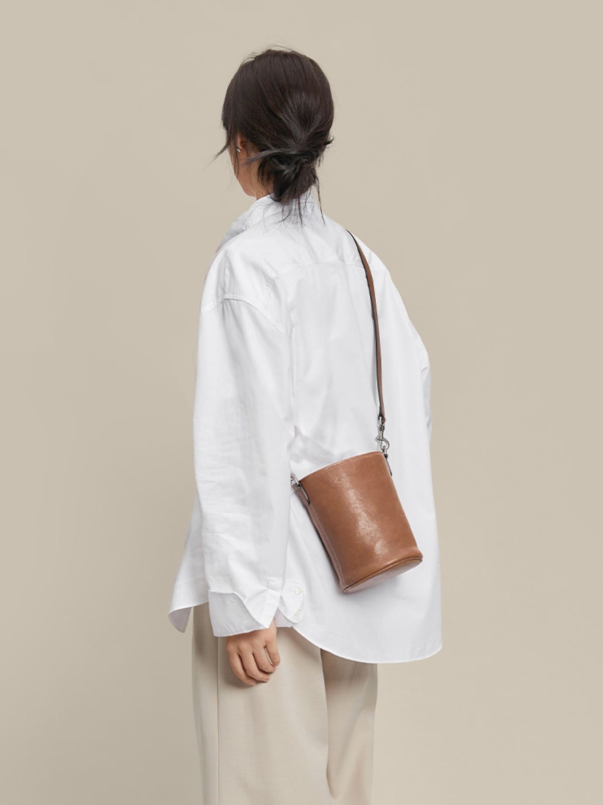 QIUZHEN Leather Drawstring Bucket Bag in Gray - On Model