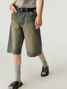 SIMPLE PROJECT Distressed Heavy Wash Denim Shorts in Blue - On Model