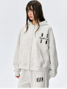 MEDM Embroidered Cotton Blend Zip Up Hoodie in Beige - On Female Model