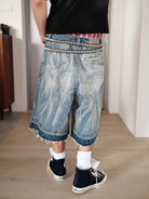 UNKNOWNWORLD Distressed Wash Baggy Shorts in Blue - On Male Model