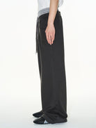 BLINDNOPLAN Double Waistband Pleated Sweatpants in Dark Gray - On Model