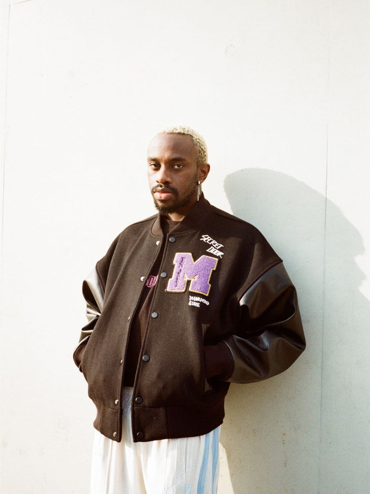 MEDM Wool Blend Varsity Jacket in Black - On Male Model