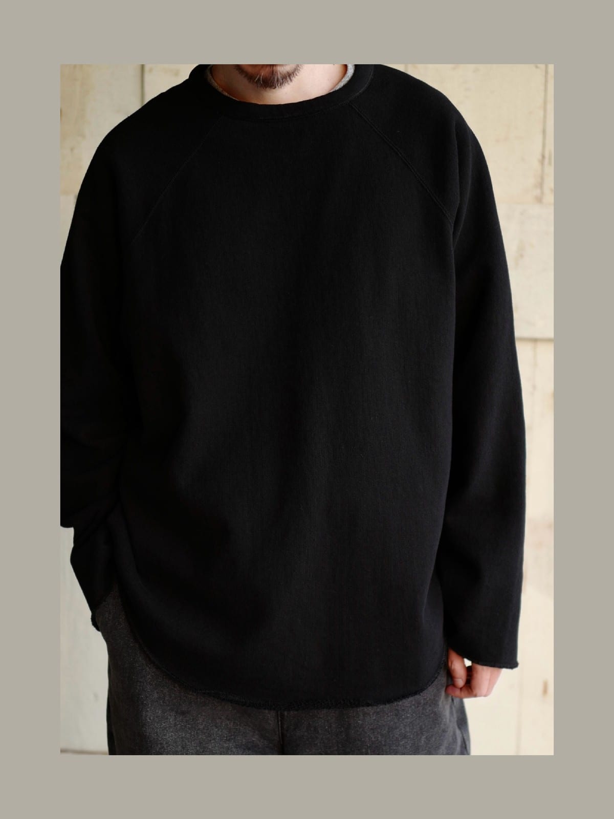 USAGE Slub Cotton Raglan Sweatshirt in Black - On Male Model
