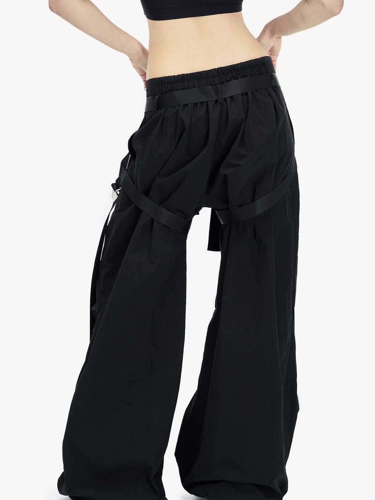 LOSTCTRL Strapped Wide Leg Parachute Pants in Black - On Female Model