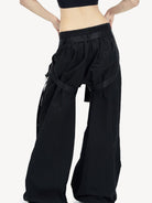 LOSTCTRL Strapped Wide Leg Parachute Pants in Black - On Female Model