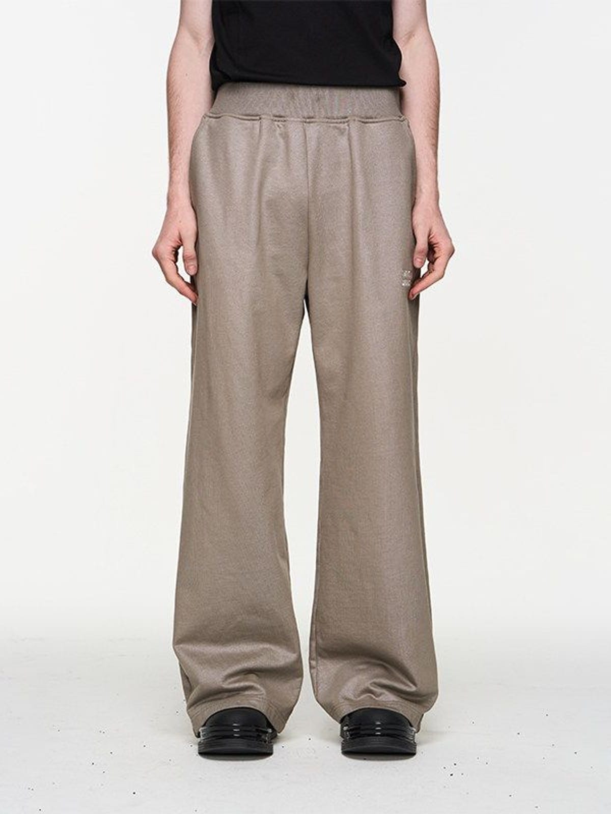BLINDNOPLAN Foil Logo Cotton Sweatpants in Beige - On Model