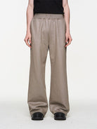 BLINDNOPLAN Foil Logo Cotton Sweatpants in Beige - On Model