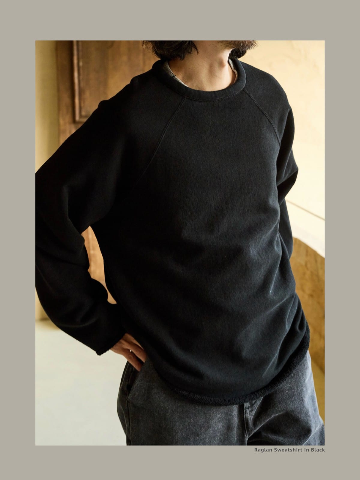 USAGE Slub Cotton Raglan Sweatshirt in Black - On Male Model