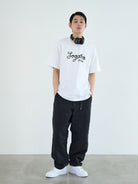 Soda Trendy Belted Cotton Nylon Tapered Pants in Black - On Male Model