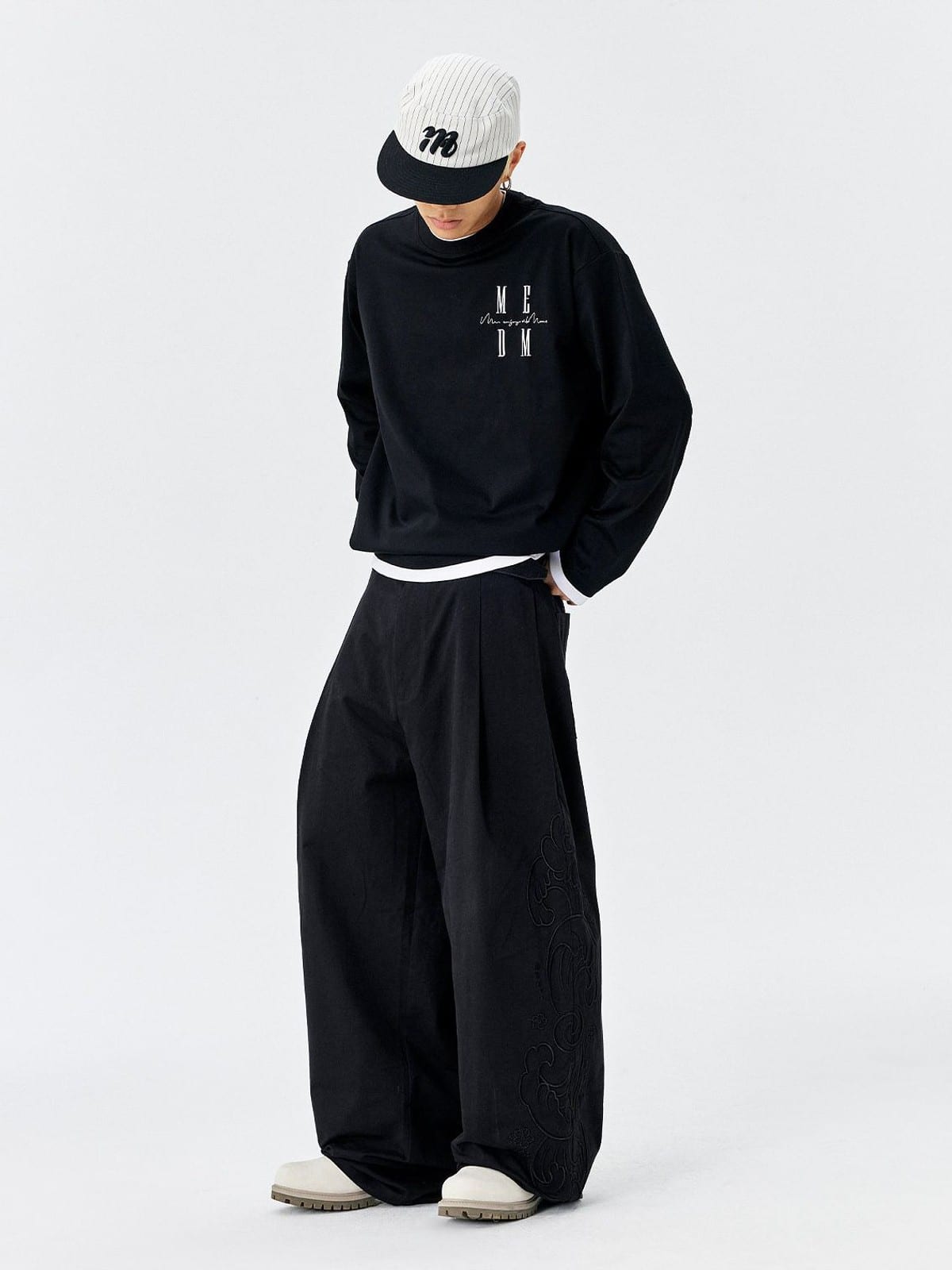MEDM Embroidered Cotton Cargo Pants in Black - On Male Model