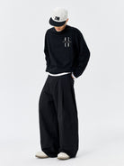 MEDM Embroidered Cotton Cargo Pants in Black - On Male Model