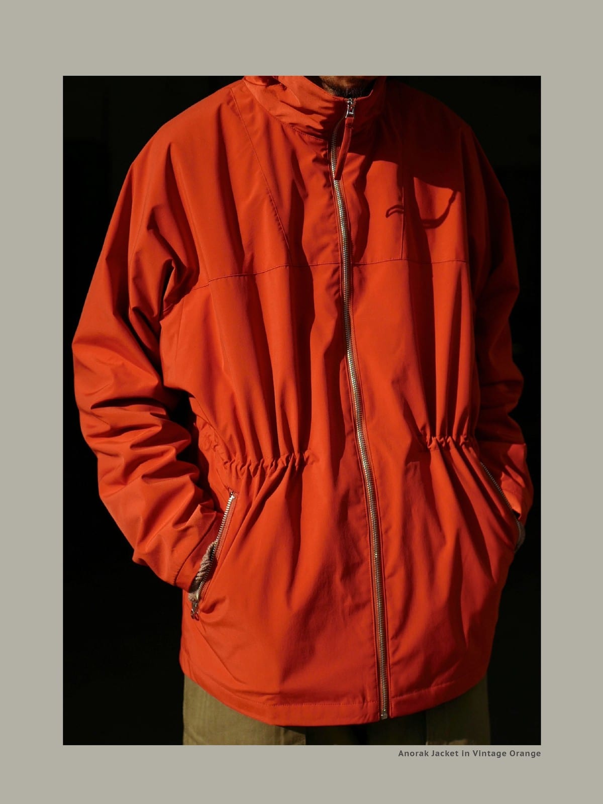 USAGE Drawstring Zip Front Tech Anorak in Orange - On Male Model