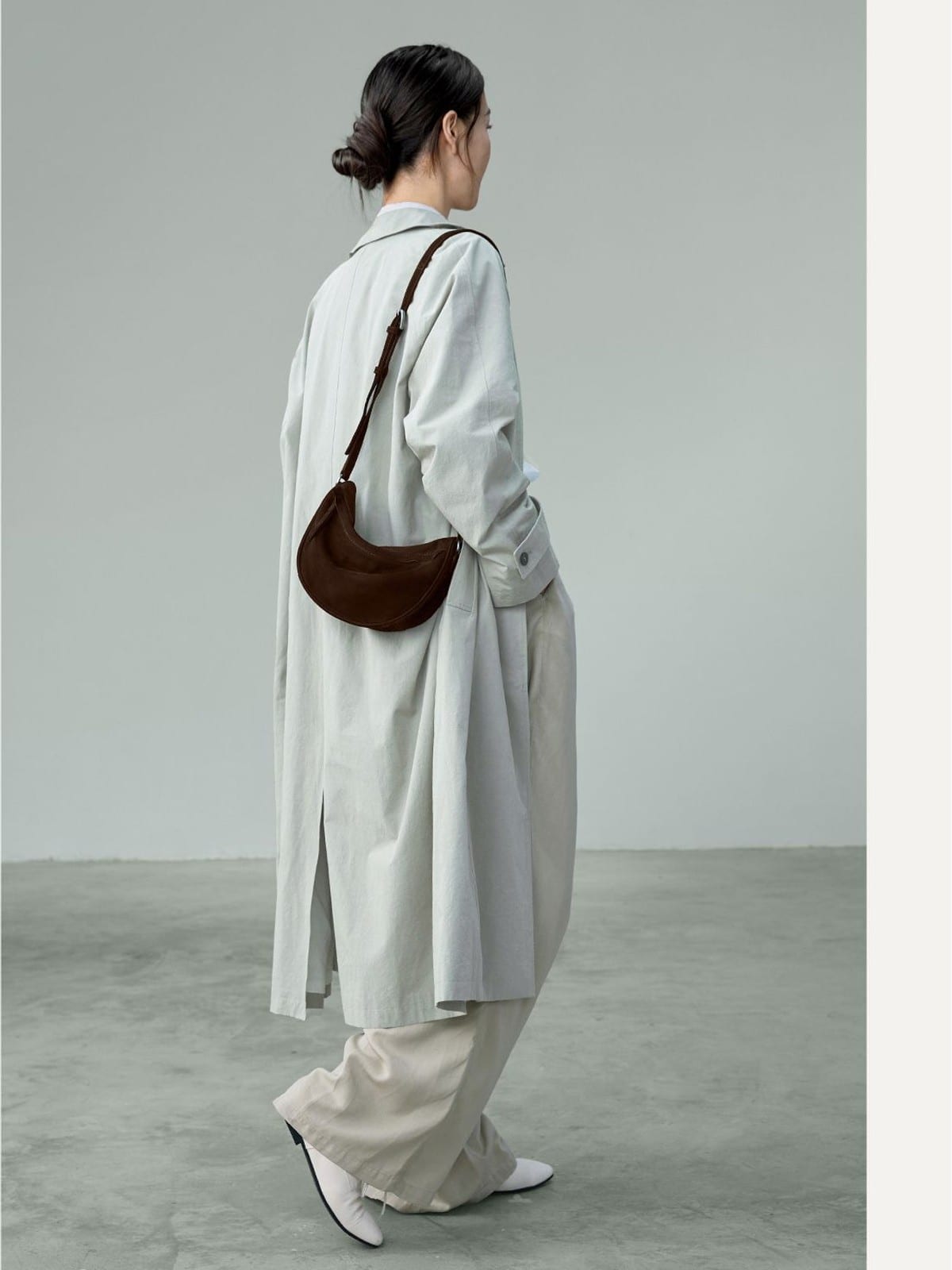 QIUZHEN Vegetable Tanned Leather Crescent Bag in Brown - On Female Model
