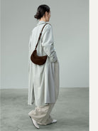 QIUZHEN Vegetable Tanned Leather Crescent Bag in Brown - On Female Model