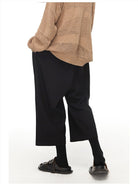 SIMPLE PROJECT Pleated Cropped Wide Leg Trousers in Black - On Model