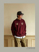 USAGE Terry Cotton Henley Sweatshirt in Burgundy - On Male Model