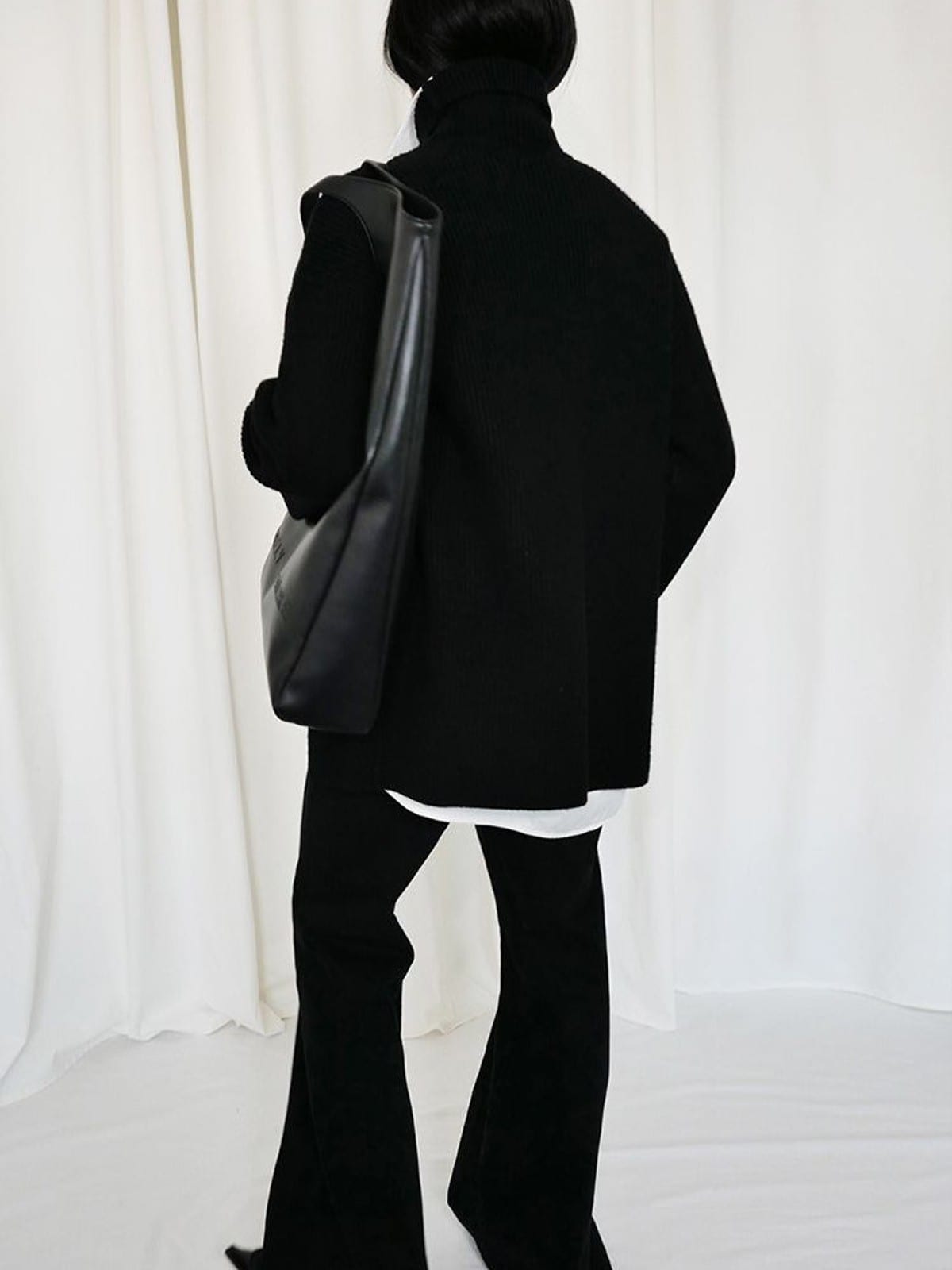RARELY ALIKE Curved Seam Denim Flare Jeans in Black - On Model