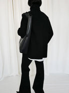 RARELY ALIKE Curved Seam Denim Flare Jeans in Black - On Model