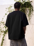 MEDM Tufted Logo Cotton T Shirt in Black - On Model